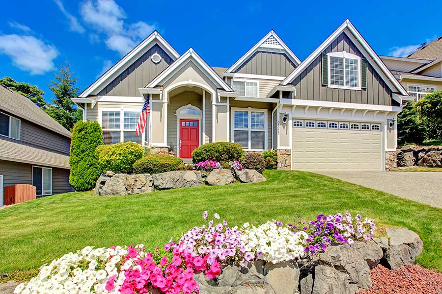 house-with-flowers-in-front-yard