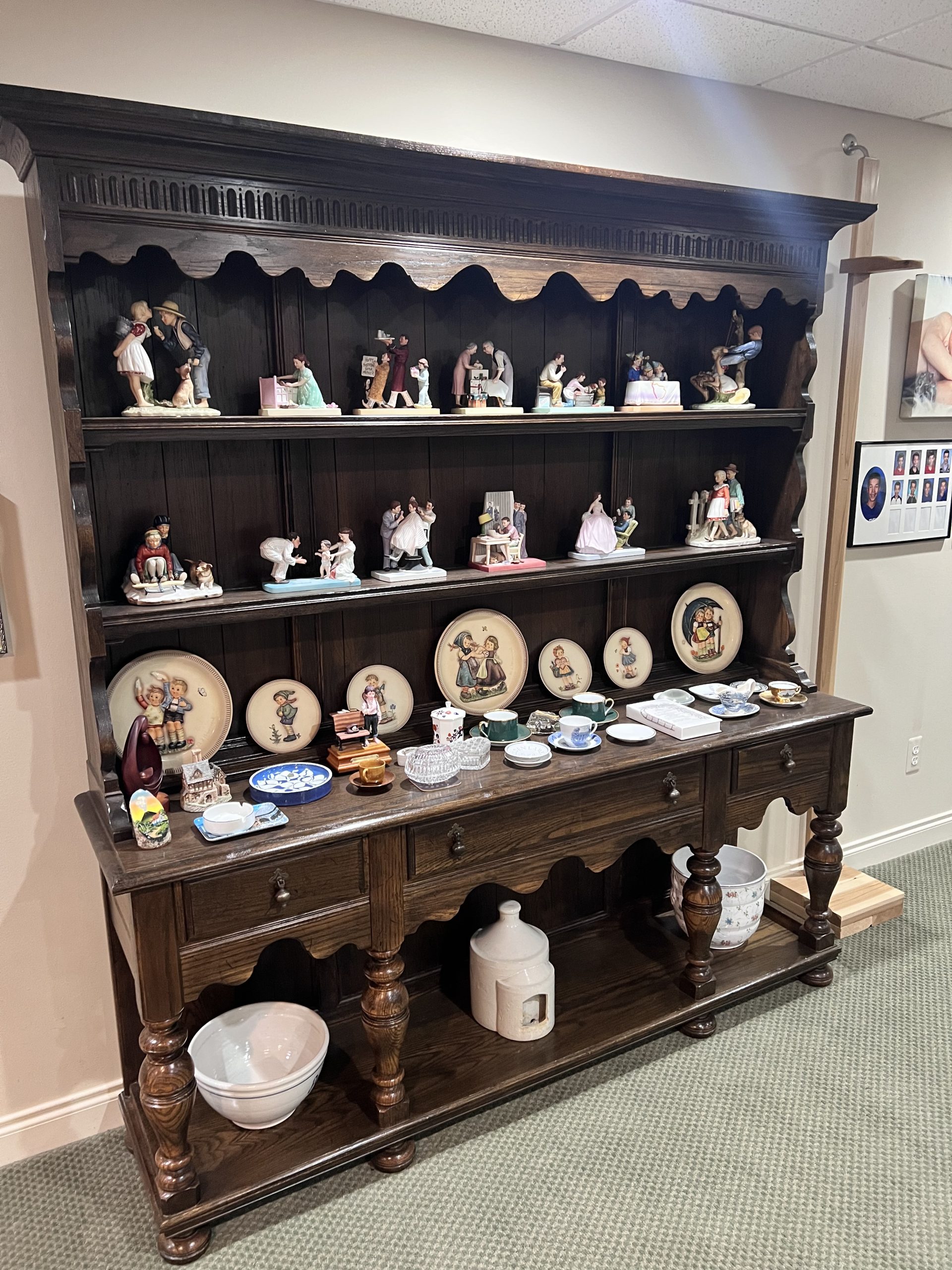 hutch with figurines, plates and tea service set