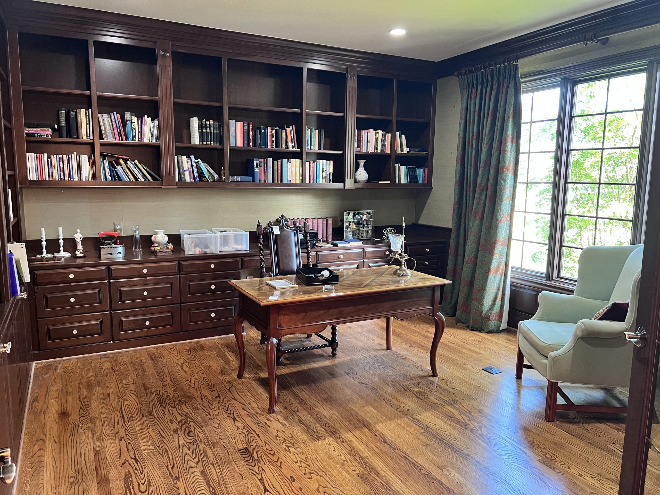 Baker furniture desk, maitland smith chairs, books, lladro, decor in estate sale home office