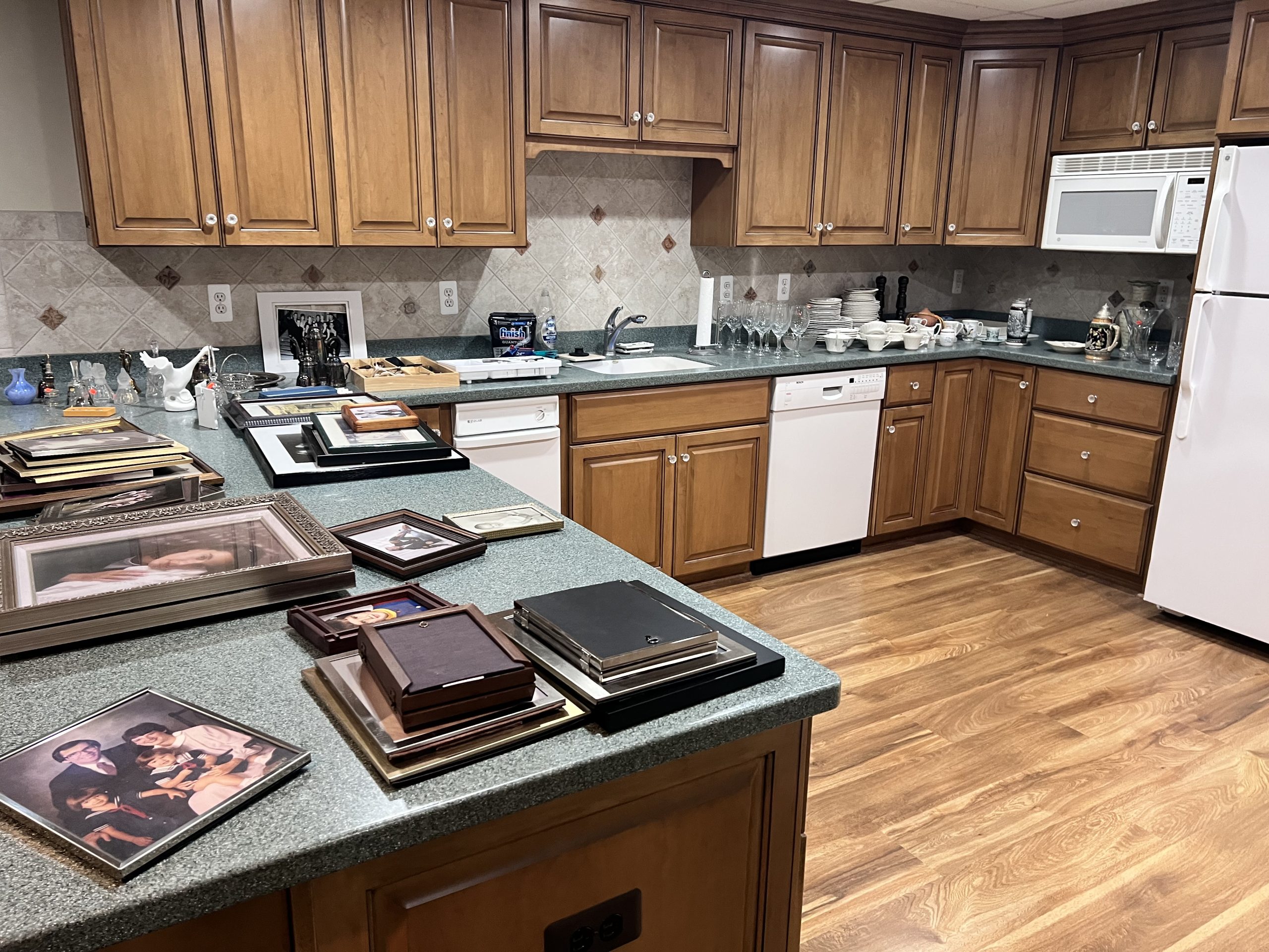 Estate sale kitchen with kitchenware, etc