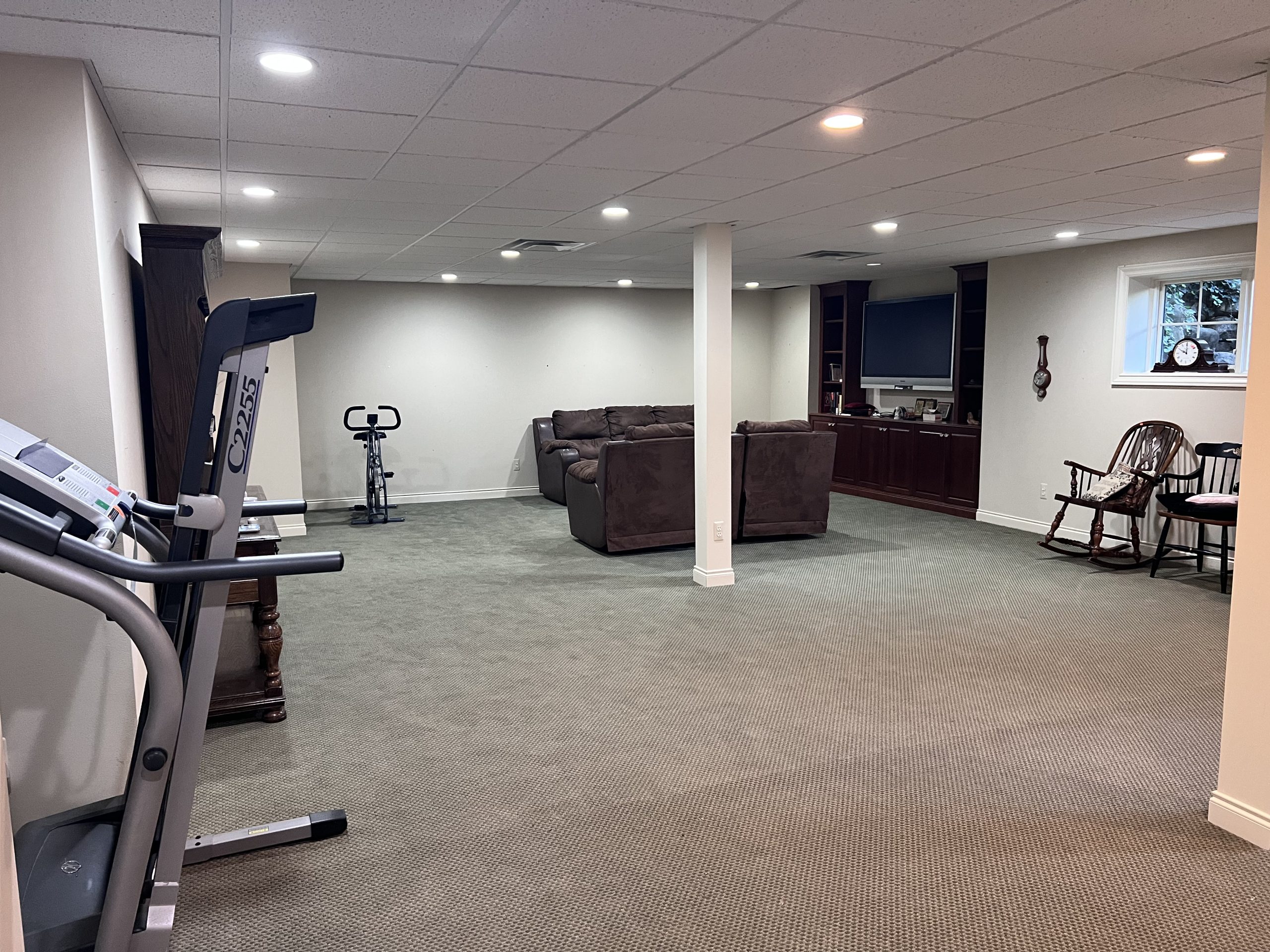 leather sofas, treadmill and decor after estate sale