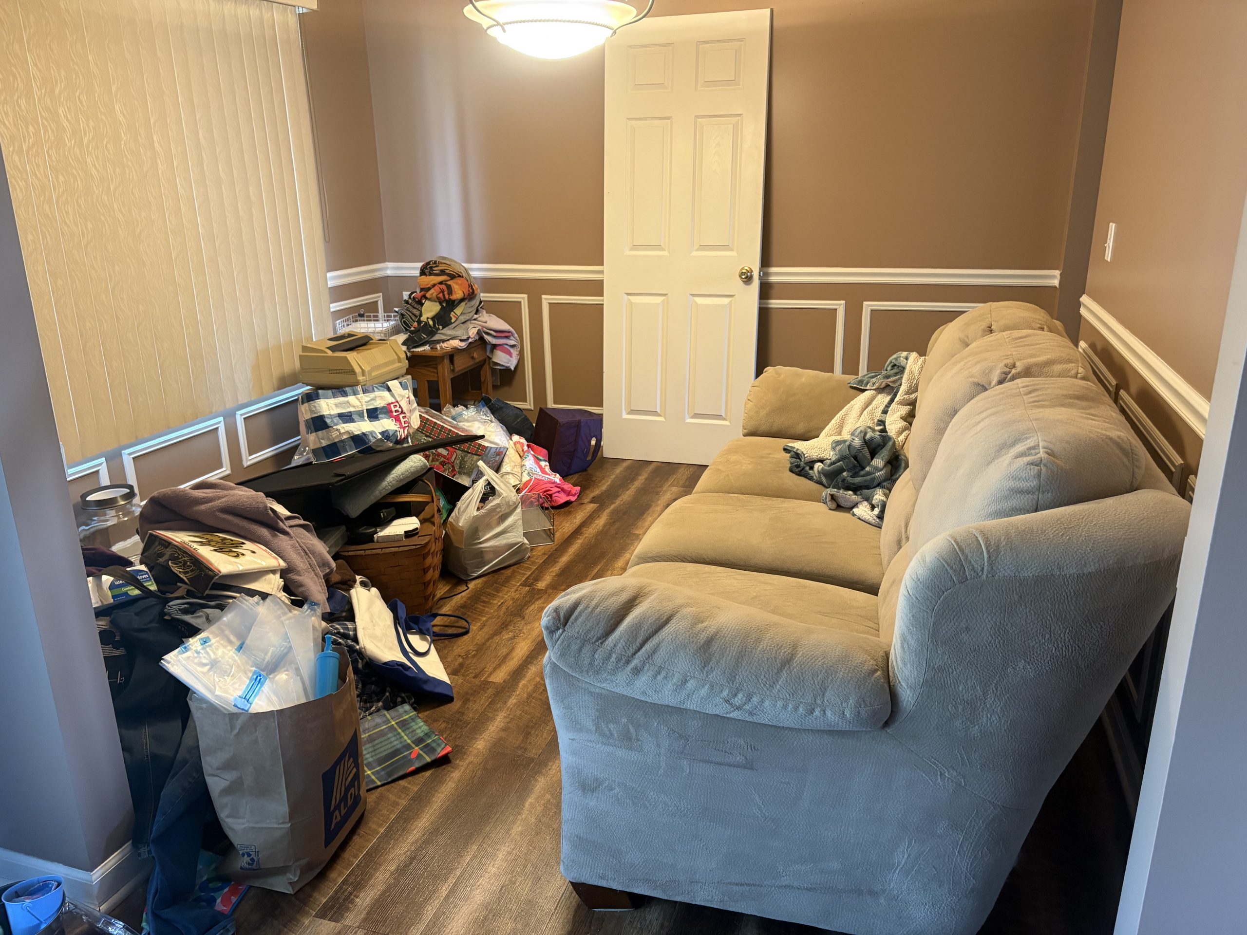 bedroom with sofa and boxes