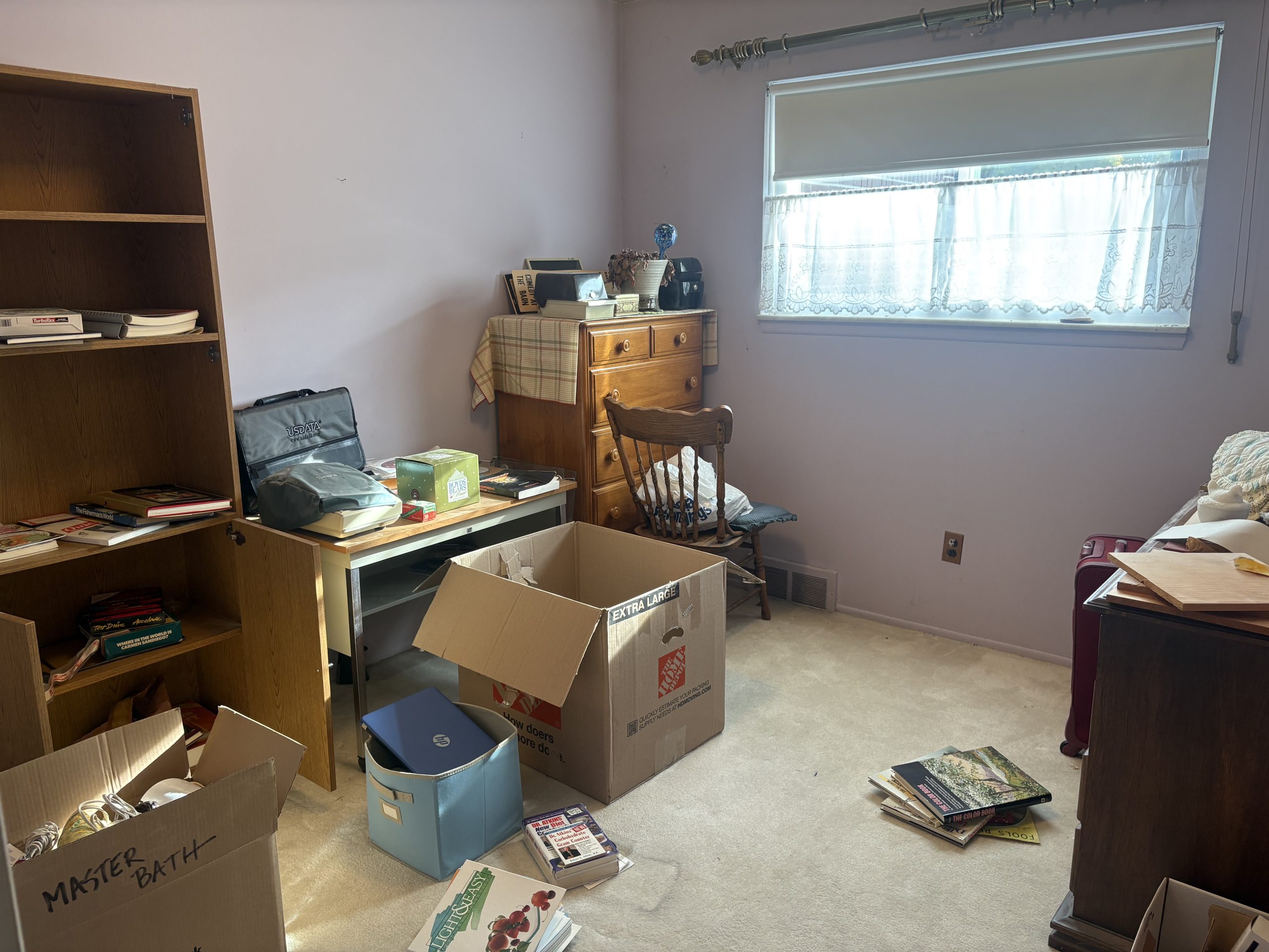 bedroom with desk boxes